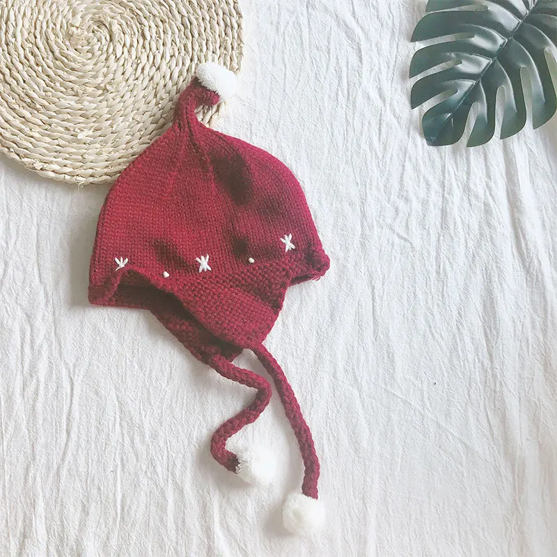 

Fashion new winter children's wool hat hair ball jacquard warm knit hat boys and girls tide bomber hat
