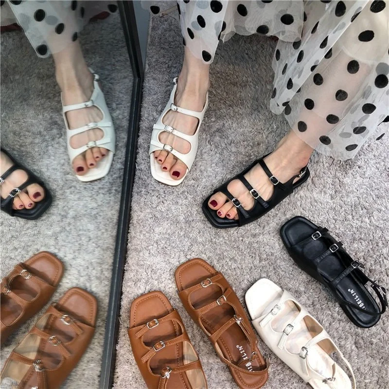 

2021 Brand Summer New Personality Fashion Roman Buckle Open Toe Flat Solid Color High-end Fashion Women's Sandals All-match Sexy