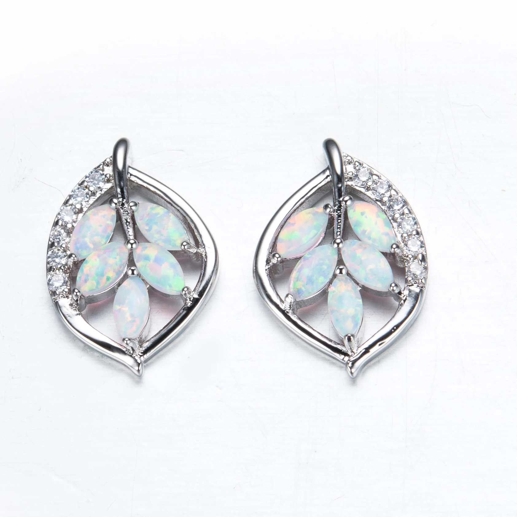 

Temperament Sweet Hollow Leaf Shape Stud Earrings White Oval Opal Earrings For Women Exquisite Sliver Color Wedding Jewelry