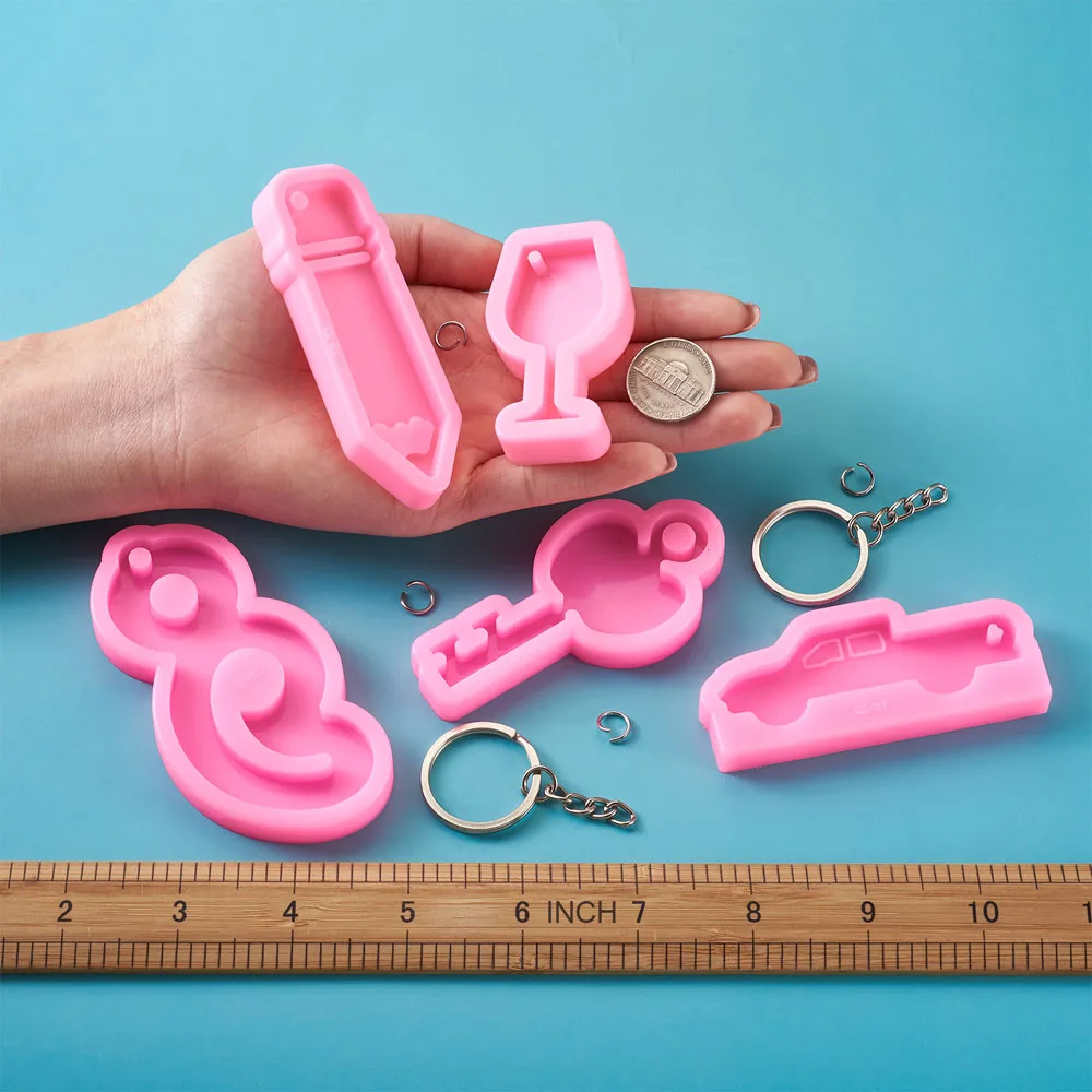 

8pcs Silicone Molds Pencil Dolphin Lip Castle Key Charm Resin Casting Molds with Key Rings Jump Rings for Keychain Craft Making