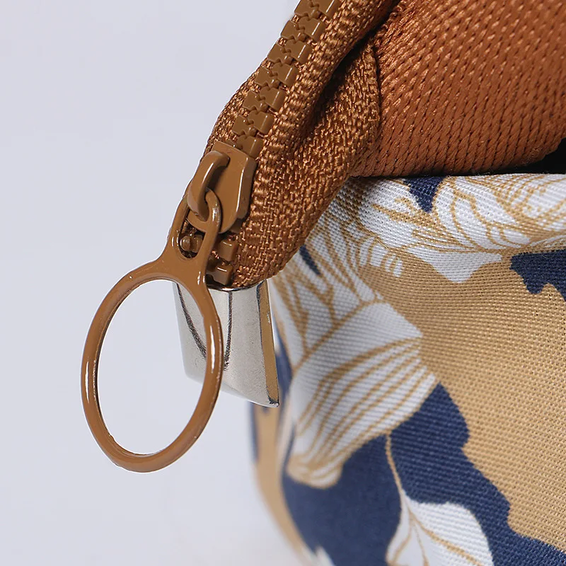 

Japanese-style mini portable cosmetic bag hand-held cosmetic large capacity waterproof feather pattern wash travel makeup bag