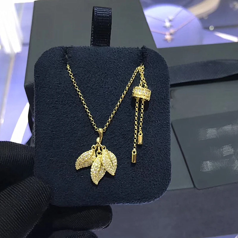 Ожерелье с подвеской в виде трех листьев из желтого золота цирконом класса ААА |