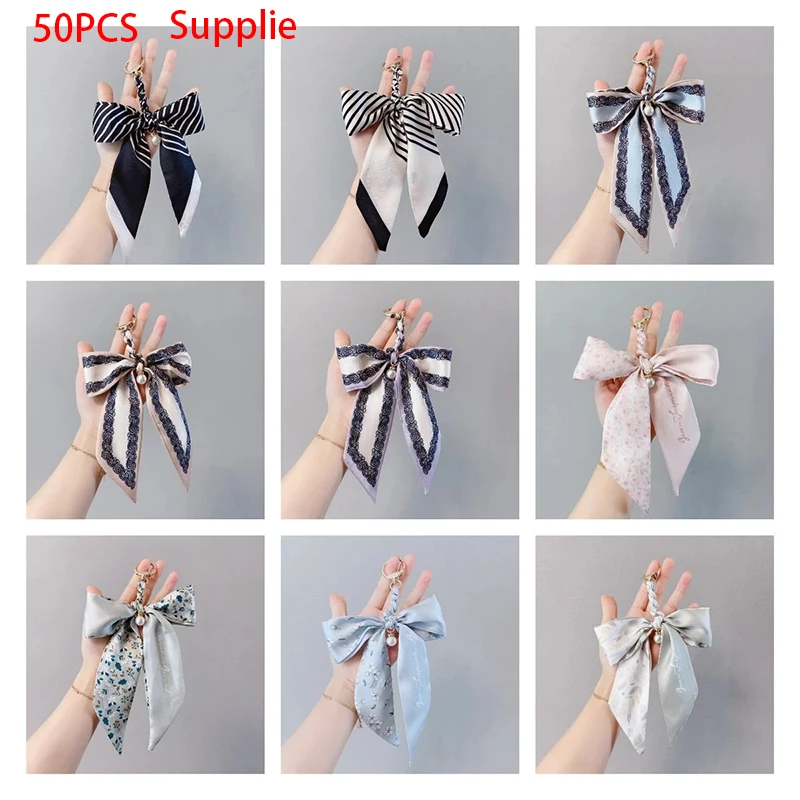 

50pcs 2021 Web Celebrity Bow Tie Silk Scarf Keychains Creative Pearl Ribbon Bow Tie Lovely Bag Car Decorative Lady Key Rings