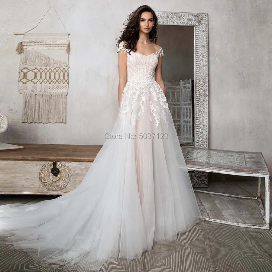 Свадебные платья трапециевидной формы с рукавами крылышками кружевные