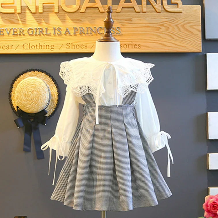 

Spring New Girls Lantern Long Sleeve Lace Hollow Out Ruffles Single Breasted Bow Blouse+suspenders Plaid Pleated Skirt 2pcs