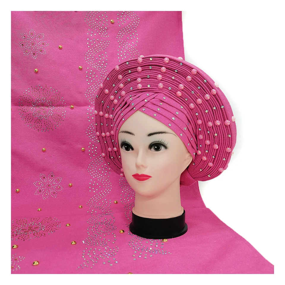 

Африканская Aso Oke уже сделала автомобильные колпачки головного убора