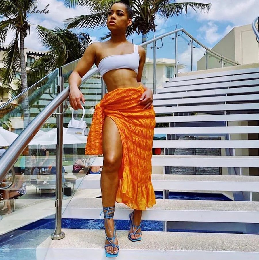 

Macheda Summer Fashion Solid Long Skirt Women Sexy Lace Up High Waist Folds Street Casual High Split Lady Orange Skirt 2021 New