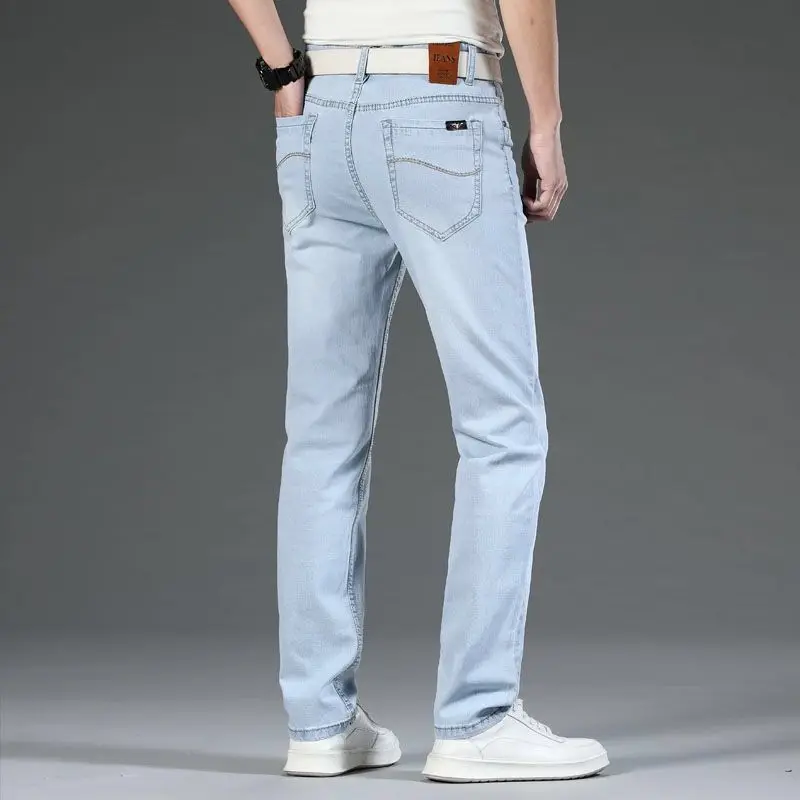 2021light jeans men's plus size straight loose elastic high-end tide brand light blue and white casual trousers bleached jeans
