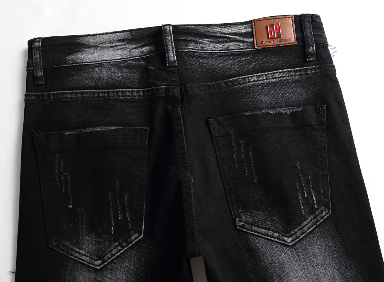 

Black Ripped Jeans Men's Slim Feet European Trend Punk Beggar Pants Boys Stretch Locomotive Skull Jeans