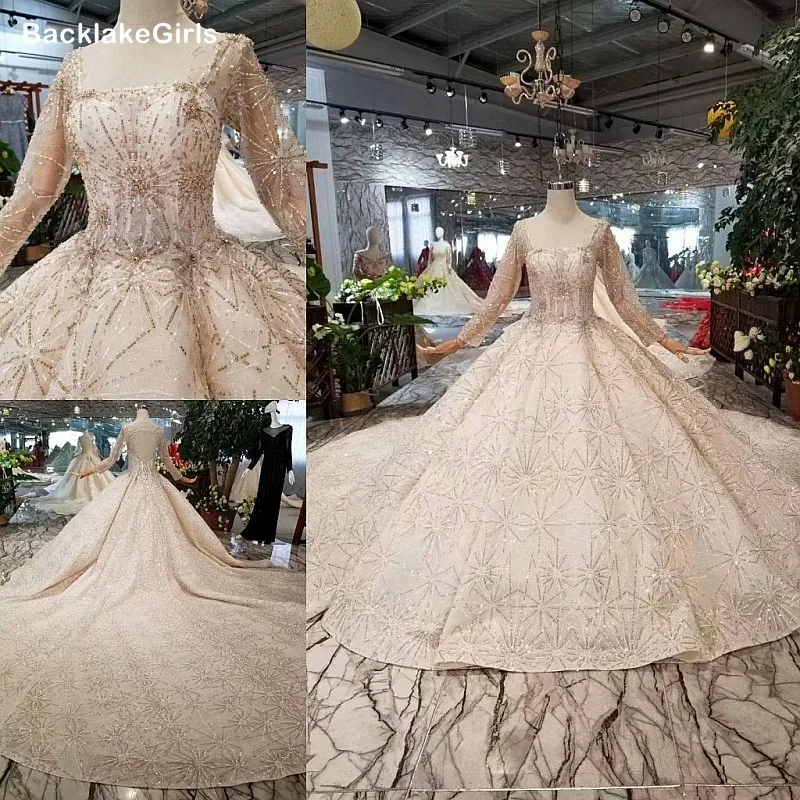 Свадебное платье с блестками круглым вырезом и длинным рукавом украшенное