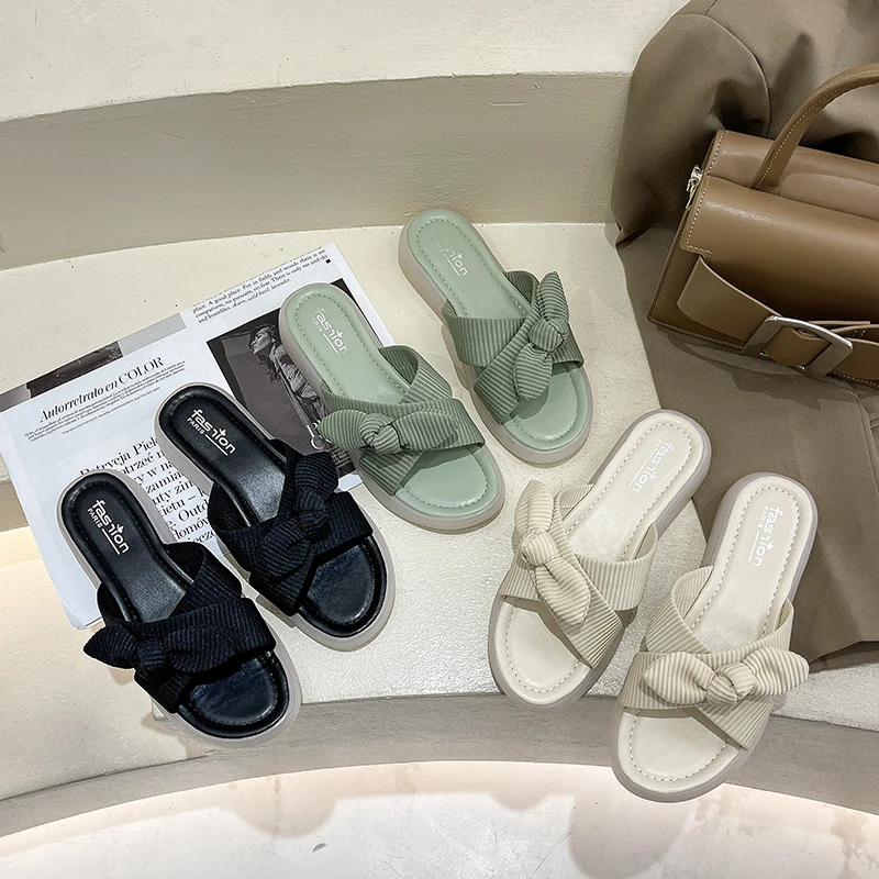

2021 summer new flat-bottomed tendon-soled slippers for women's outer wear with bow knots cross-flip casual beach sandals