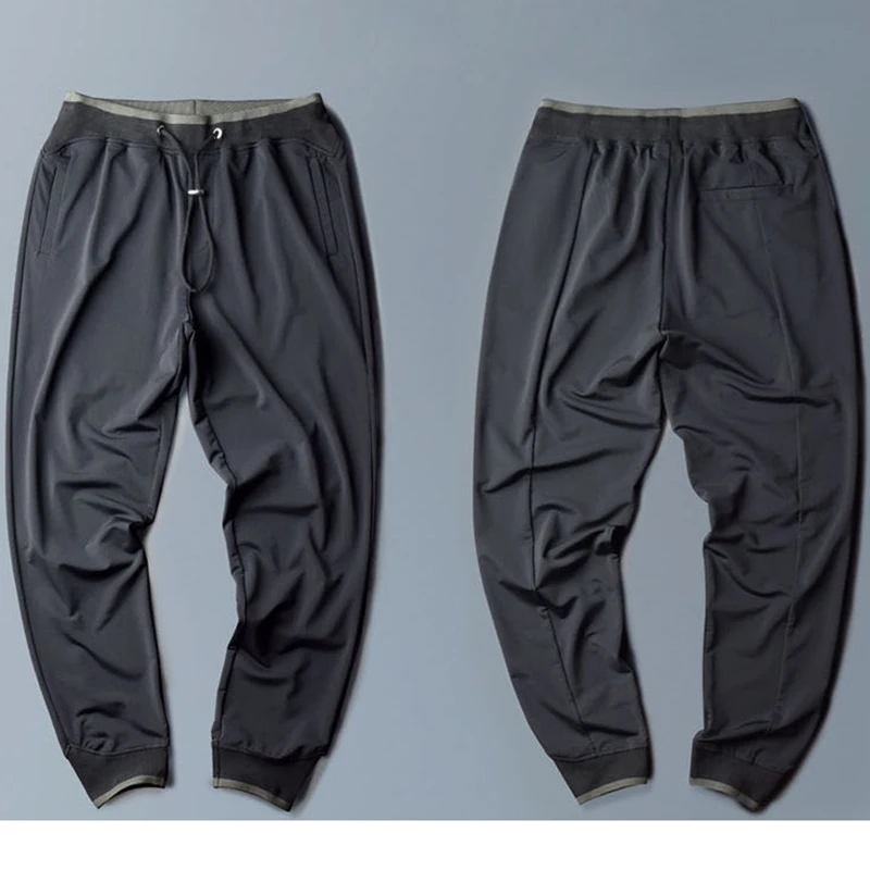 

New ice silk trousers men's summer thin waist quick-drying sports and leisure trousers men's stretch silky nine-point pants