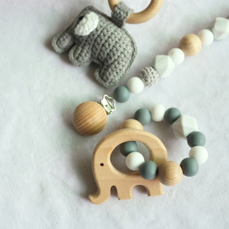 

Baby Dummy Holder Pacifier Chain Silicone Bead Bracelet Infant Wood Ring Teether