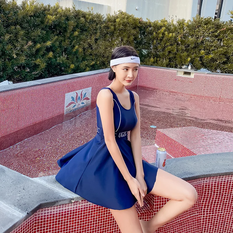 Женский купальник из двух предметов темно синий с плиссированным подолом и