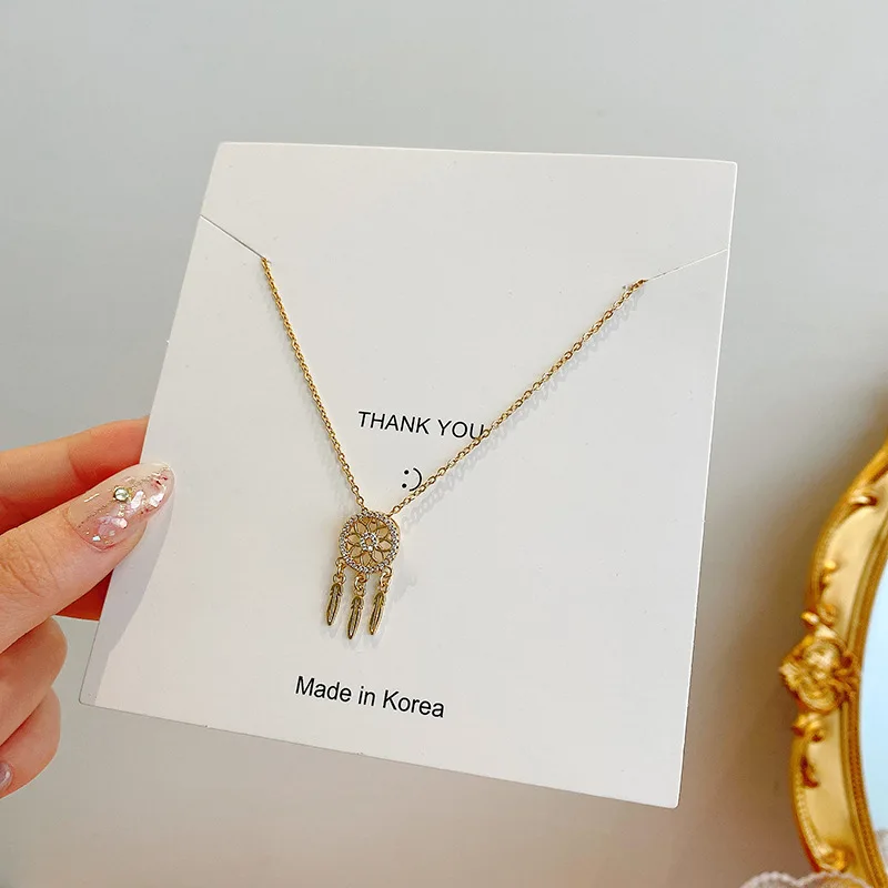 

2021 fashion simple personality exquisite hollow round titanium steel zircon tassel pendant necklace