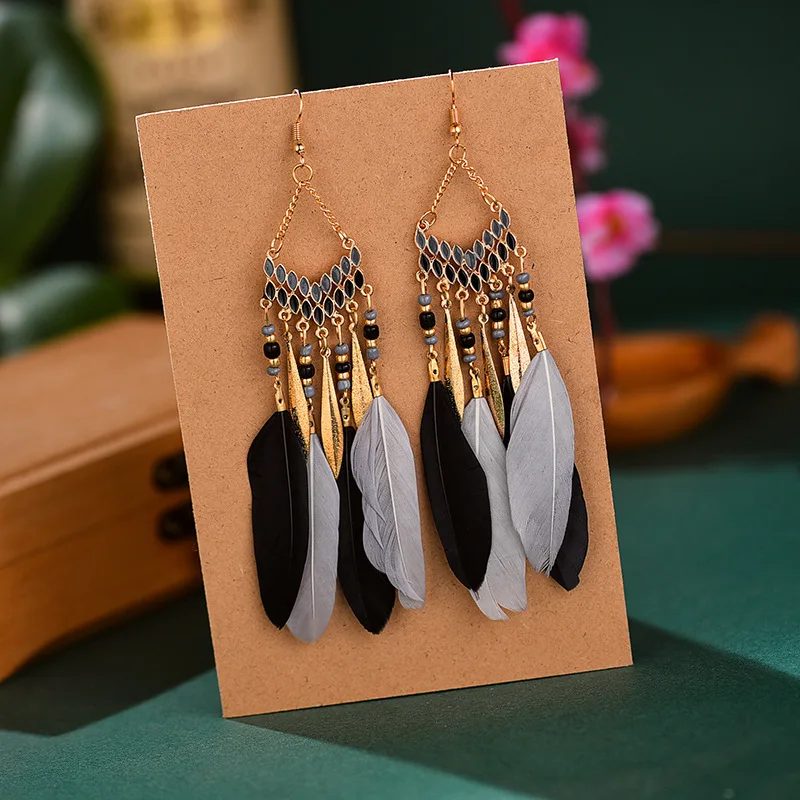 

Fan-shaped Tassel Fashion Feather Pop Earrings Female Long Bohemian Explosion-style Rice Beads European Earrings
