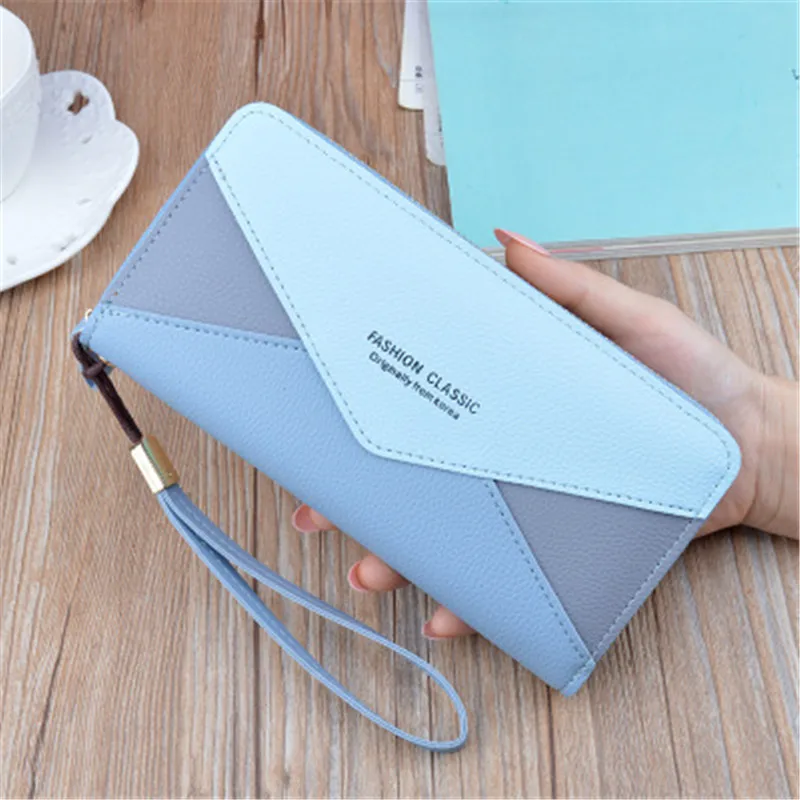 

New Wallet Ms. Long Zipper Wallet Girl Student Korean Stitching Contrast Tassel Envelope Handbag