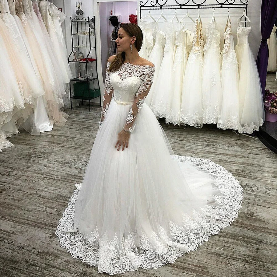 

Boat Neck Appliqued Lace Beaded Wedding Dresses Long Sleeve With Bow Sashes Tulle Court Train Wedding Gown vestido de noiva