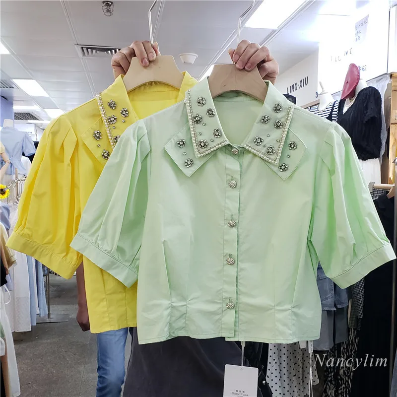 Chemise courte pour Femmes 2021 Été Nouveau Simple Boutonnage Manches Bouffantes Exquis Strass Revers Tout-Assorti Haut Court Dame Blusas