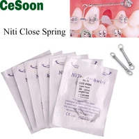 10pcbag dental orthodontic close spring coil niti elastic tooth torque with pull teeth ring 0 0080 0100 0120 014691215mm