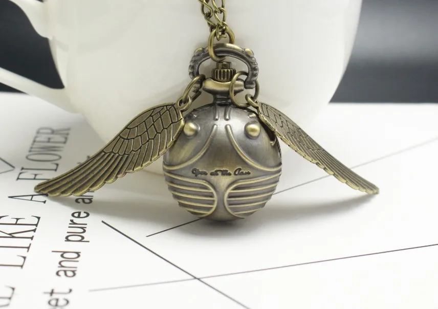 Часы кварцевые карманные в форме «мяч Снитча», модные ретро-часы со свитером, крыльями ангела, цепочкой и ожерельем, подарок для мужчин, женщ... от AliExpress RU&CIS NEW