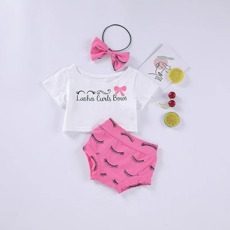 

Hot sale cute girl 0-2 years old, playful eyelash print head flower + white T-shirt + pink print shorts three-piece suit