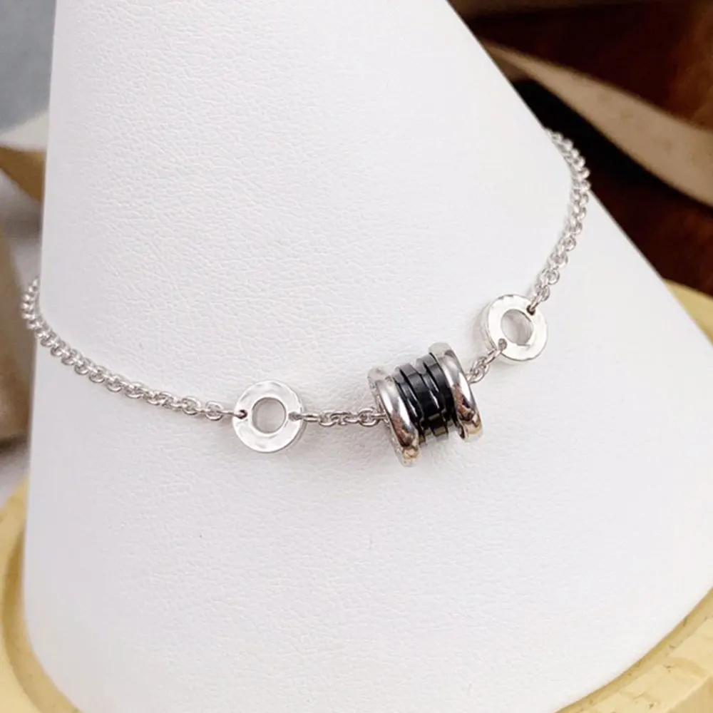 

KT Luxury LOGO Bracelets 1:1High Quality Roman Classic Charity Black Ceramic Spring Spiral Bracelet BVL Jewelry Woman