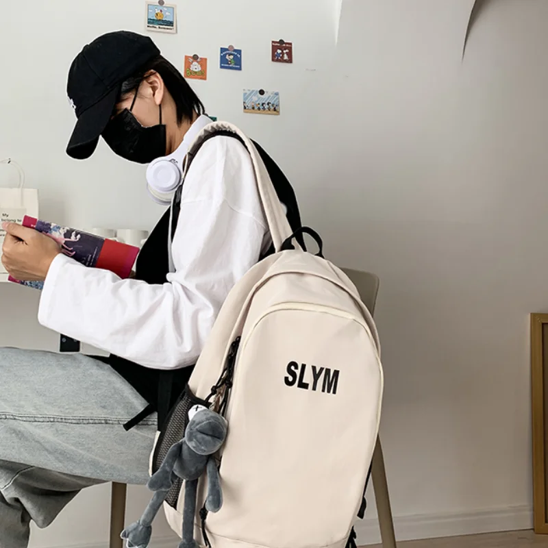 

Casual ins nylon school bag female Korean version of pure color wild backpack tide men and women vintage sense backpack