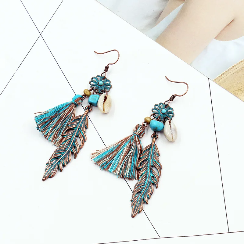 Синие серьги гвоздики с кисточками цветами перьями ракушками подвесками птицами