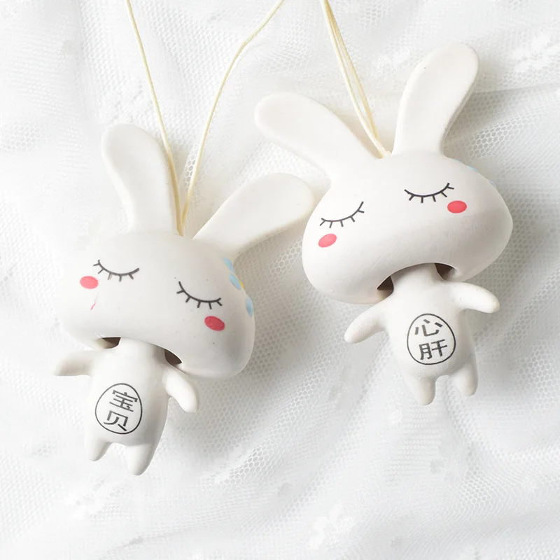 

Ceramic wind chime creative cartoon rabbit couple mobile phone pendant bag