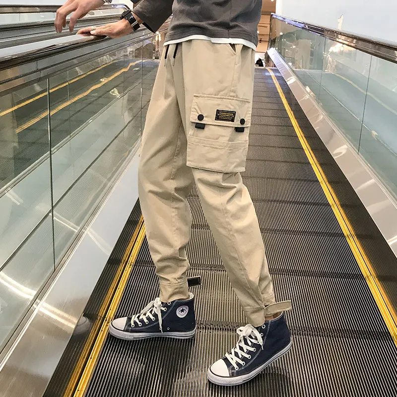 

Мужские брюки-карго с боковыми карманами, черные повседневные мужские джоггеры с лентами 2021 в стиле хип-хоп, брюки, модная повседневная Улич...
