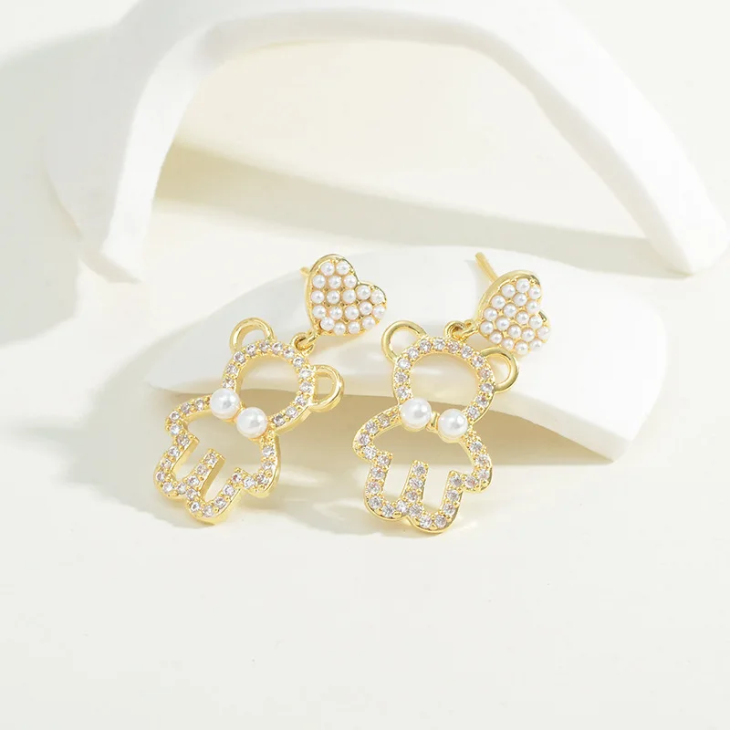 

Cute bear earrings South Korea Dongdaemun sweet super fairy hollow design earrings 925 silver peach heart small earrings