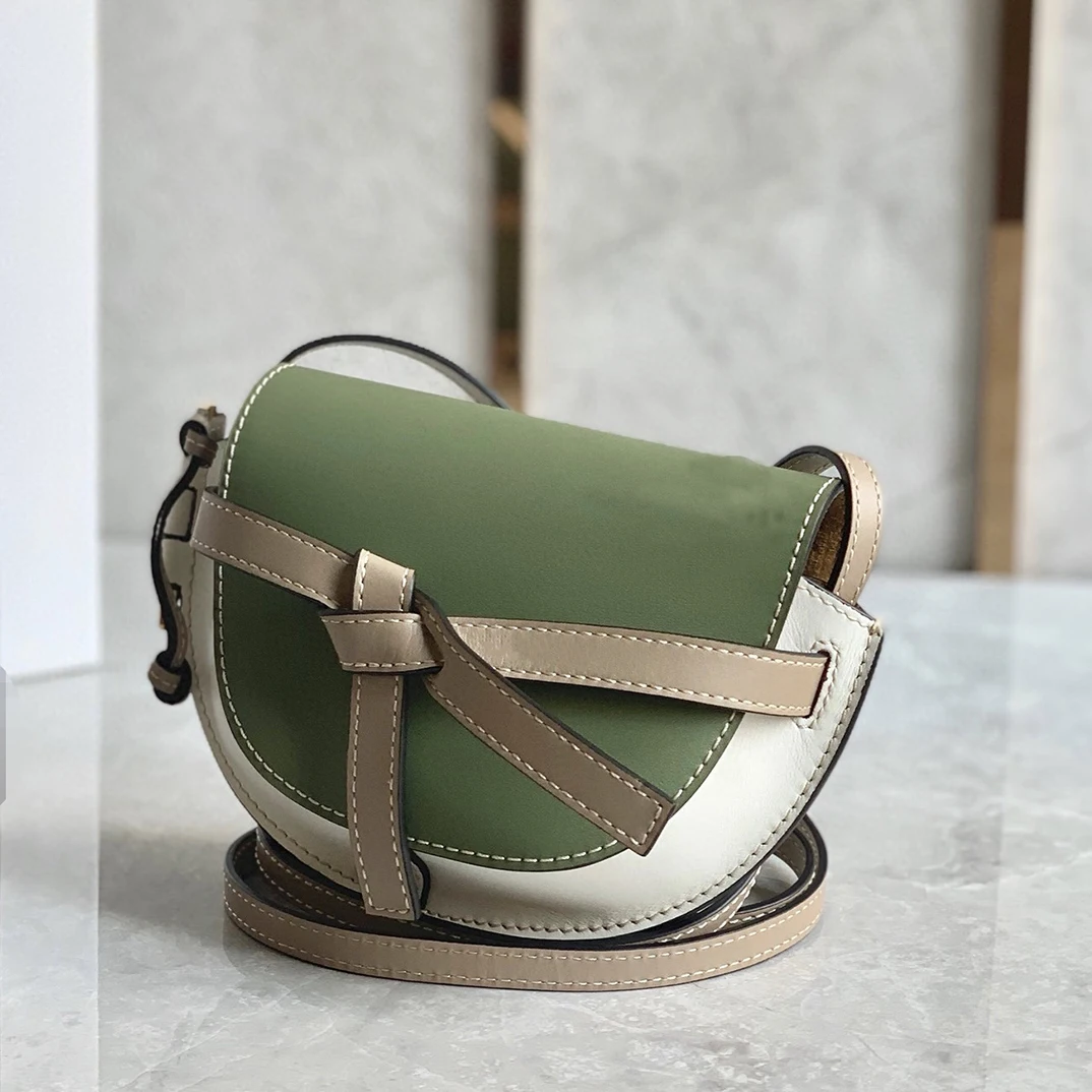 

2021 New Brand New Women's Bag Large And Small Color Matching Bow Leather One Shoulder Messenger Bag Triangle Saddle Patchwork