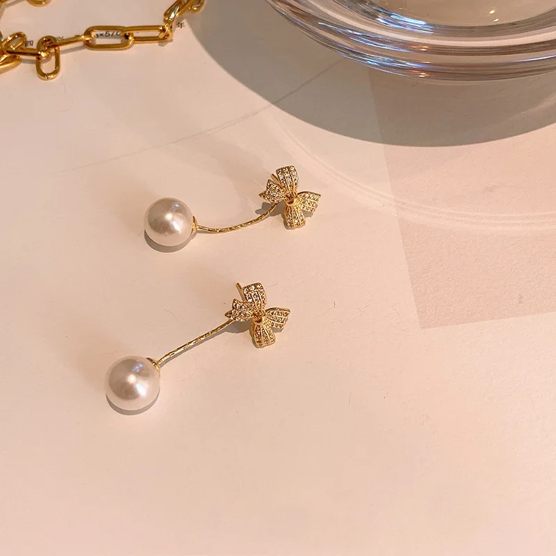 

Bow pearl earrings female temperament personality two earrings fashion earrings
