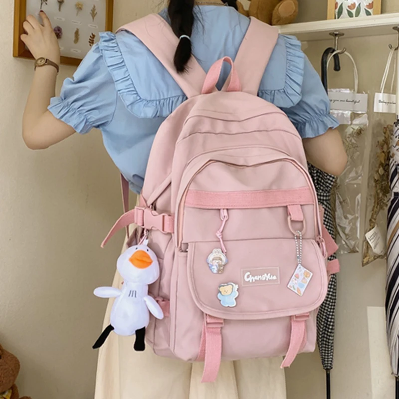 

EST kawaii Duck Waterproof Nylon Shoulders bag 2021 WOMEN SCHOOL BAG Girls Teenage Student Acrylic Badge Solid Color Backpack