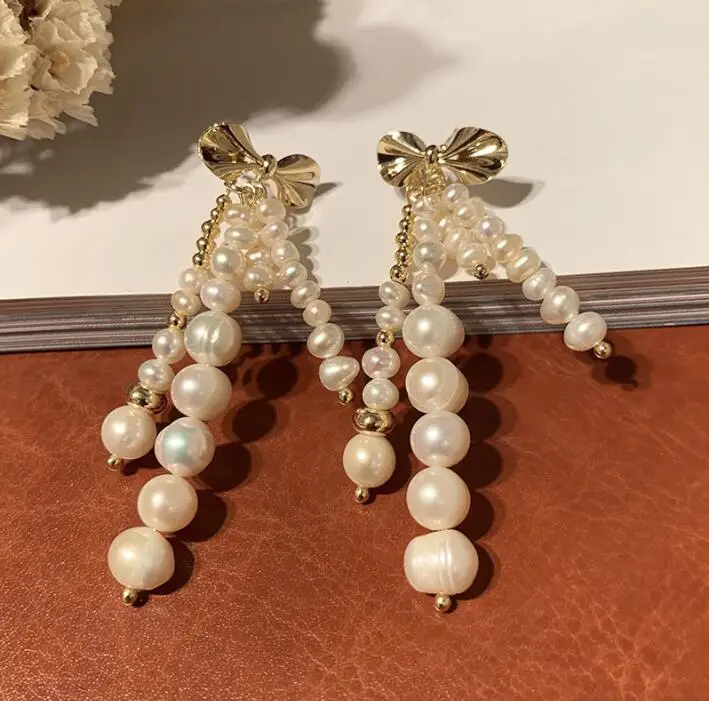 

Женские серьги-кисточки с бантом, серебро 925 пробы