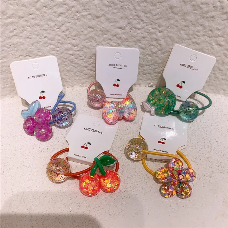 

2021 Korean Children's Sweet Transparent Glitter Fruit Flower Bow Rubber Band Hair Rope Fashion Girl Ponytail Hair Accessories