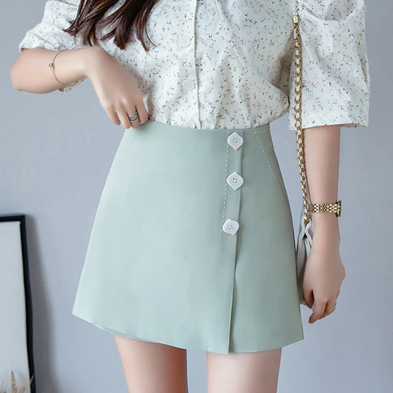 Mode Style D'été Femmes Blanc Shorts Jupes Décontracté Femmes Taille Haute Irrégulière Short Streetwear Simple Boutonnage Mini Jupes