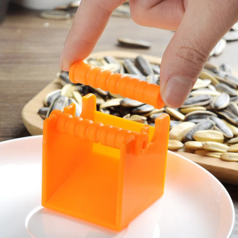 

2Pcs Creative Melon Seed Shelling Machine Opener Peeler Automatic Household Sunflower Seeds Cracker Peel Tool for Home Kitchen