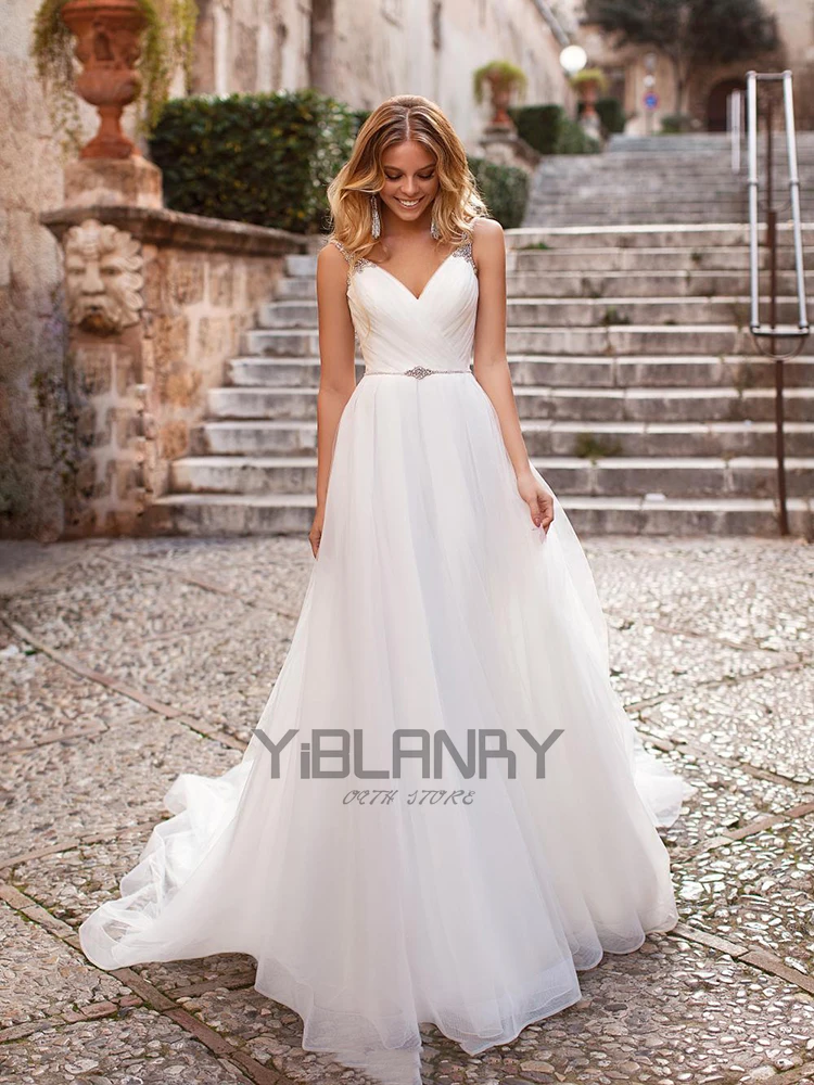 

Luxury Wedding Dress Tulle And Beading With A-line V-neck Sleeveless Spahrtti Strap Bride Dresses Backless Button Plus size