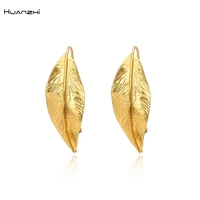 huanzhi 2020 retro gold color metal leaf stud earrings geometric irregular plant earring for women girls party travel jewelry
