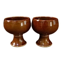 a pair of porcelain bright brown glazed goblets