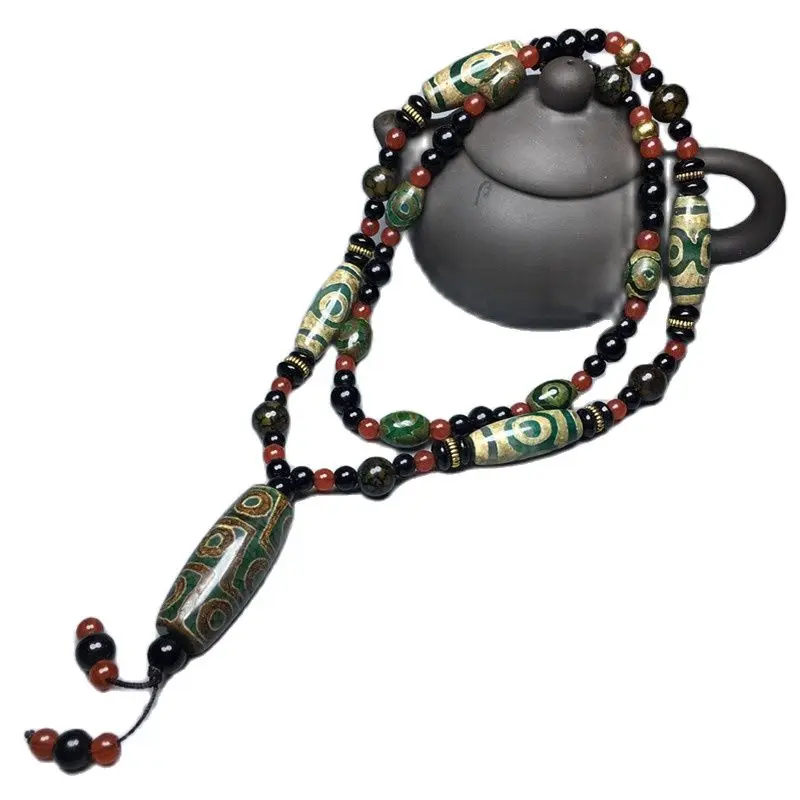 

Подвеска из тибетского агата с тремя глазами и девятью зелеными глазами