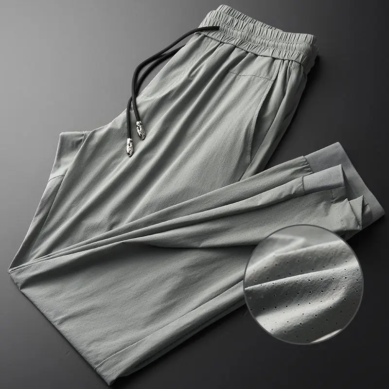 

Summer thin casual pants 9-point men's silk smooth cool fabric hollow out breathable fashion closed sports pants men's pants