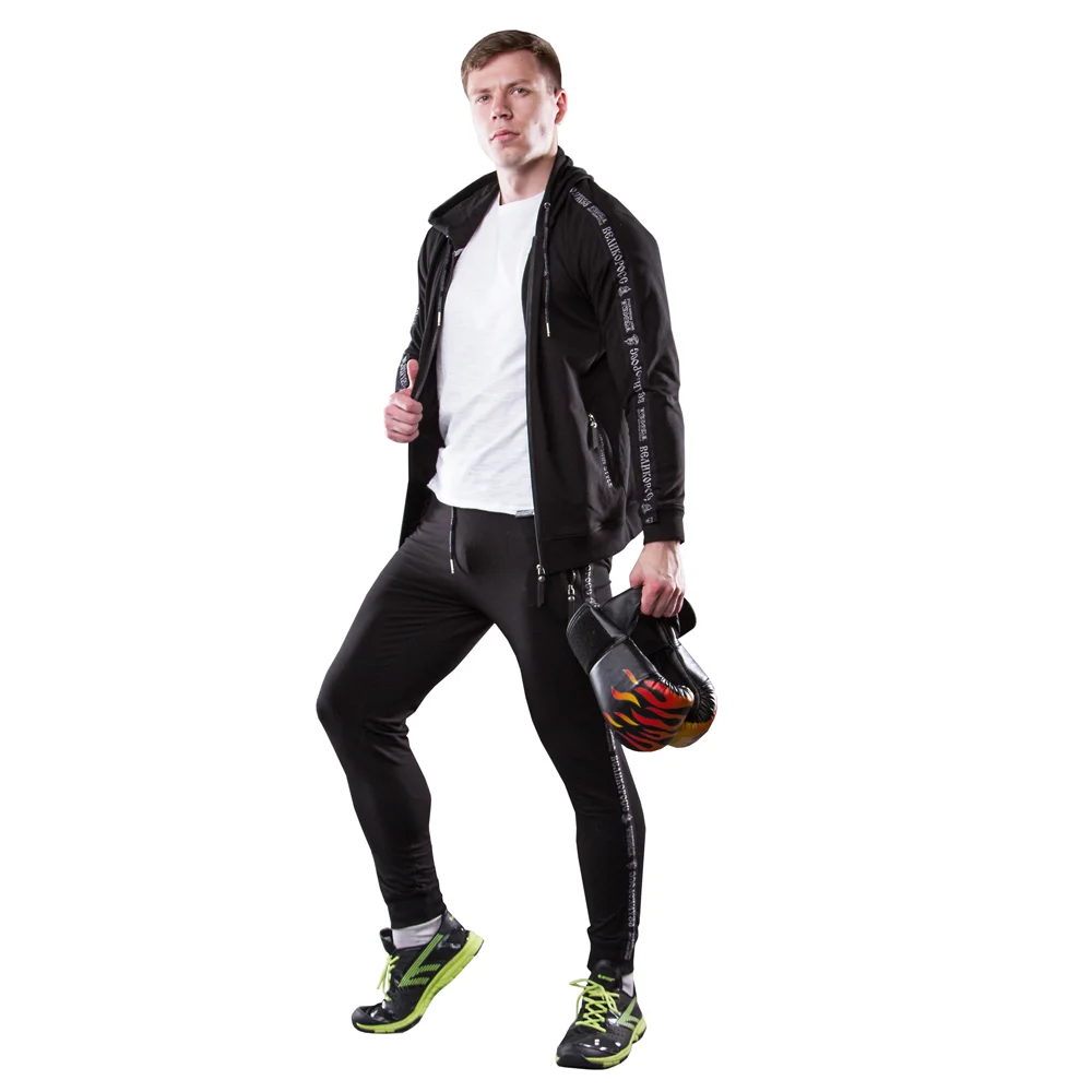 Спортивный костюм Великоросс черного цвета жаккардовые лампасы и брендовые