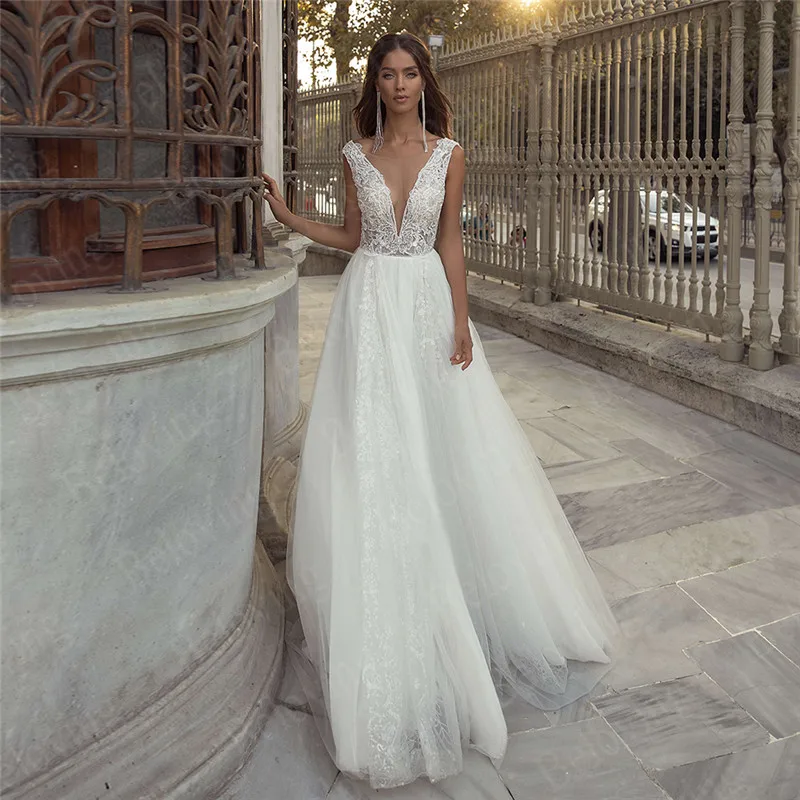 

Robe De Mariee Beach Beading Wedding Dresses 2021 Sequin Appliqued A Line Bridal Gowns Sexy Backless Floor Length Bride Dress