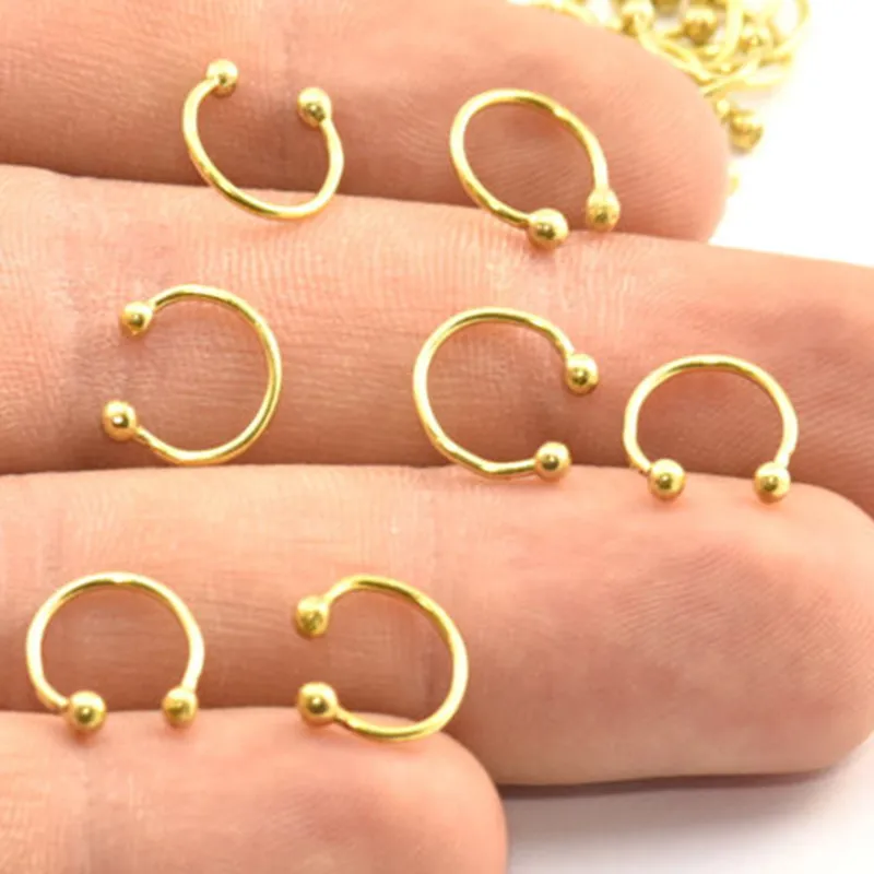 

24 шт. .. Сырые латунные перегородки, носовые кольца, подвески. Подвески (10x0,9 мм) BS 2134