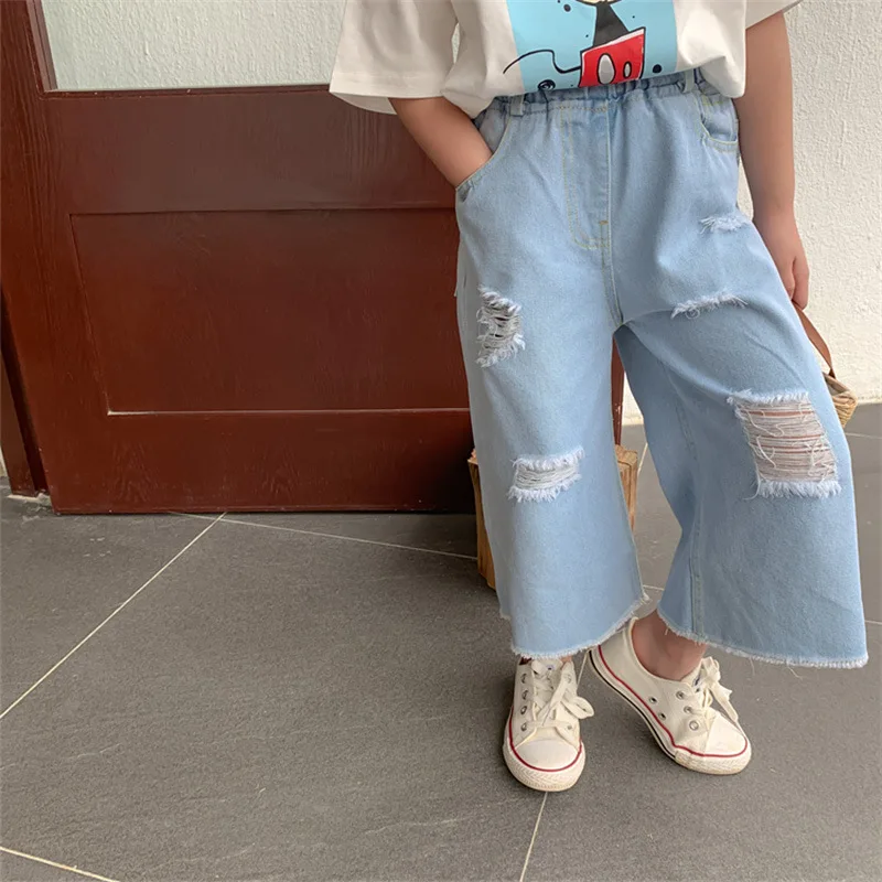Рваные джинсы для девочек детские штаны с вырезами белые модные брюки широкими