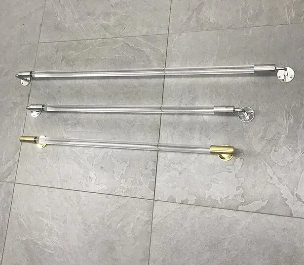 

Clothing store on the wall display stand is hanging acrylic crystal stainless steel gold transparent wall hanging rack.