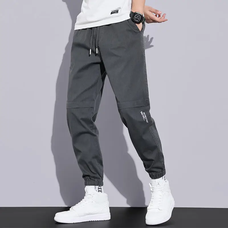 

Sports casual pants men's new loose all-match buckle overalls 2021 spring and summer youth Harlan nine-point pants trendy brand